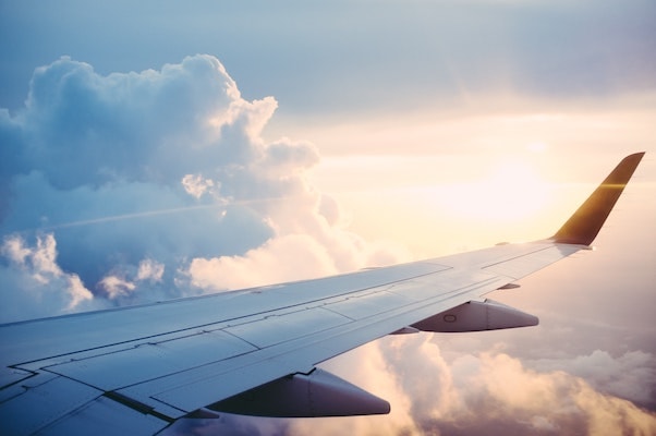 The wing of an aeroplane in sunset